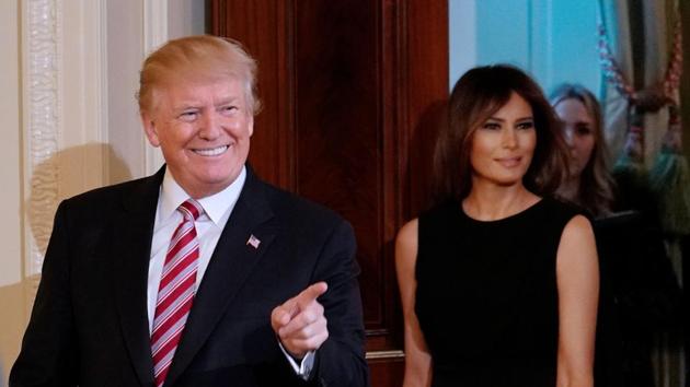 US President Donald Trump and First Lady Melania Trump arrive for a National African American History Month reception in the East Room of the White House on February 13, 2018 in Washington, DC. (AFP Photo) US President Donald Trump and First Lady Melania Trump arrive for a National African American History Month reception in the East Room of the White House on February 13, 2018 in Washington, DC. (AFP Photo)