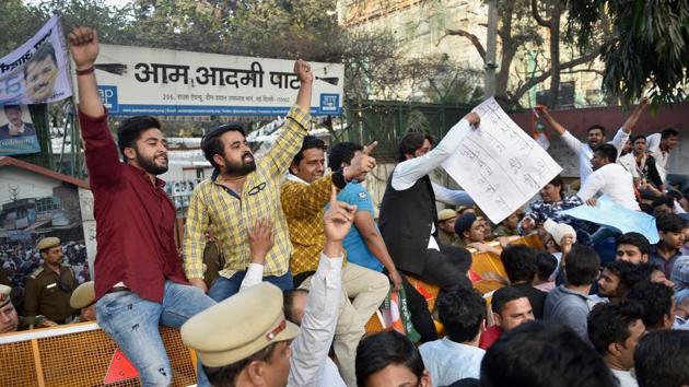 New Delhi: Indian Youth Congress activists shouts protest against Delhi Chief Minister Arvind Kejriwal in New Delhi on Wednesday.(PTI)