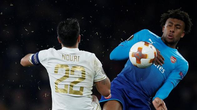 Arsenal FC's Alex Iwobi vie for the ball with Ostersunds FK's Brwa Nouri during their Europa League match in London on Thursday.(REUTERS) Arsenal FC's Alex Iwobi vie for the ball with Ostersunds FK's Brwa Nouri during their Europa League match in London on Thursday.(REUTERS)