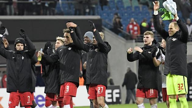 Leipzig's players celebrate with supporters after the Europa League football match against Napoli in Leipzig, Germany, on Thursday(AP)