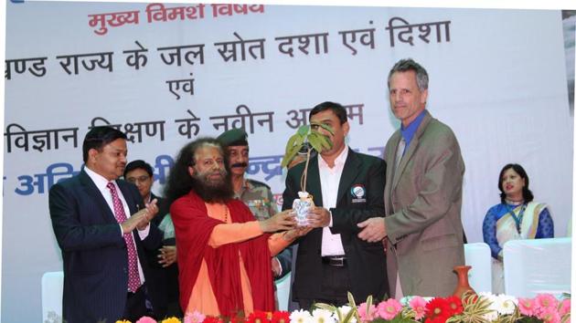 Guests being felicitated at the two-day seminar on rejuvenation of water resources in Uttarakhand.(HT Photo)