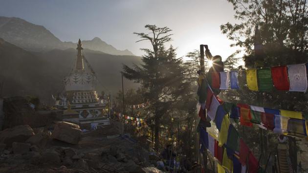 A man ties multicoloured prayer flags called lungta, or wind horse, at a pole on the third day of the Tibetan New Year in Dharmsala on February 18. Tibetans believe that the prayers inscribed on these flags representing the five elements, earth, fire, water, space and air, are spread on wind. (Ashwini Bhatia / AP)