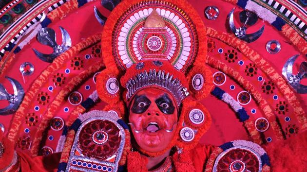 An artist performs 'Theyyam', a popular traditional dance also known as 'Kaliyattam', during a promotional event organised by India's Kerala state tourism department in Hyderabad on February 20. (Noah Seelam / AFP)