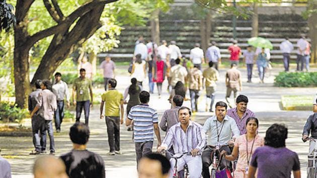 Infosys Technologies employees move through the headquarters during a break in Bangalore. The Trump administration has announced a new policy that makes tough the procedure of issuing H-1B visas to those to be employed at one or more third-party worksites, a move that will hugely impact Indian IT companies and their employees.(AP File Photo)