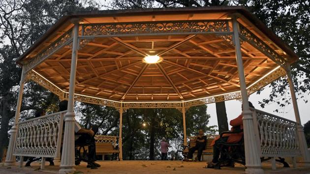 People relax as the sun sets. (Shashi S Kashyap/HT) 