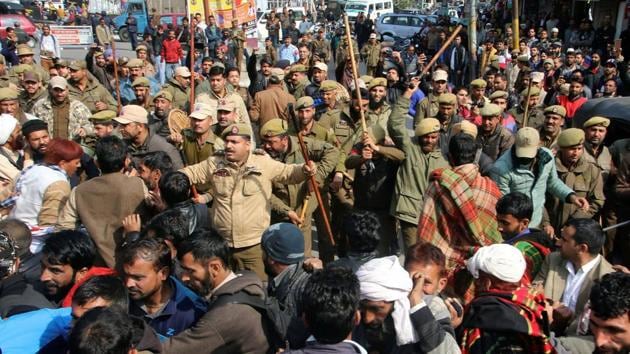 Police trying to control a group of people protesting the rape and murder of an eight-year-old girl in Kathua, Jammu, January 30 (PTI) Police trying to control a group of people protesting the rape and murder of an eight-year-old girl in Kathua, Jammu, January 30 (PTI)