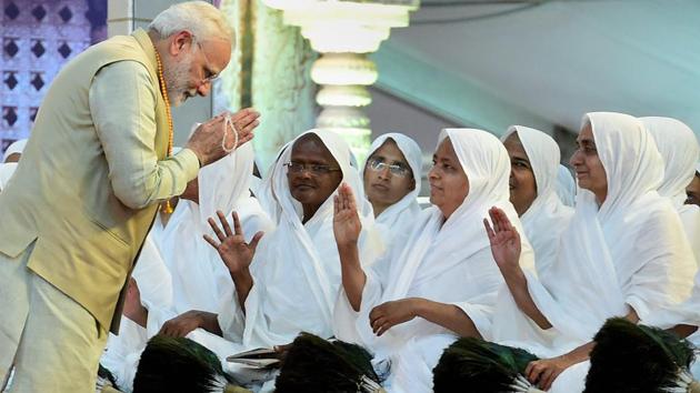 PM Narendra Modi greets the saints as he arrives at Bahubali Mahamasthakabhisheka Mahotsava at Shravanabelagola in Hassan on February 18. (Shailendra Bhojak / PTI)