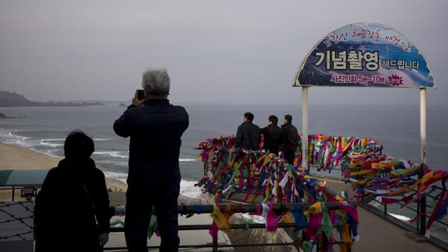 At the observatory, many visitors were seen having their pictures taken with Diamond Mountain in the background with messages calling for inter-Korean peace, a successful Olympics and their families’ health. (AP) At the observatory, many visitors were seen having their pictures taken with Diamond Mountain in the background with messages calling for inter-Korean peace, a successful Olympics and their families’ health. (AP)