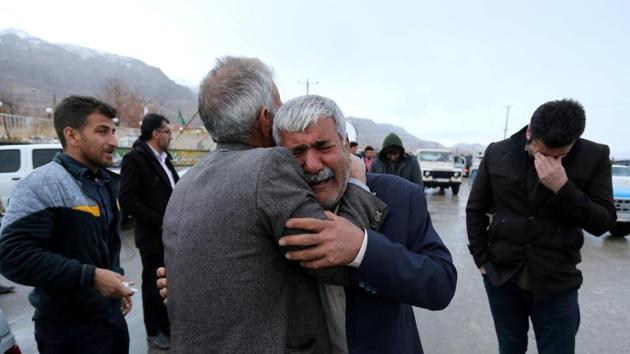 Relatives of passengers who were believed to have been killed in a plane crash gather near the town of Semirom, Iran on February 18. (Tasnim News Agency / REUTERS) Relatives of passengers who were believed to have been killed in a plane crash gather near the town of Semirom, Iran on February 18. (Tasnim News Agency / REUTERS)