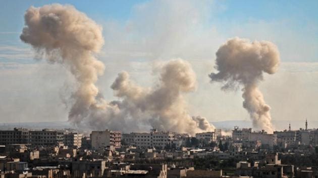 Smoke rises from buildings following bombardment on the village of Mesraba in the rebel-held besieged Eastern Ghouta region on the outskirts of the capital Damascus, on February 19. (Hamza Al-Ajweh / AFP) Smoke rises from buildings following bombardment on the village of Mesraba in the rebel-held besieged Eastern Ghouta region on the outskirts of the capital Damascus, on February 19. (Hamza Al-Ajweh / AFP)