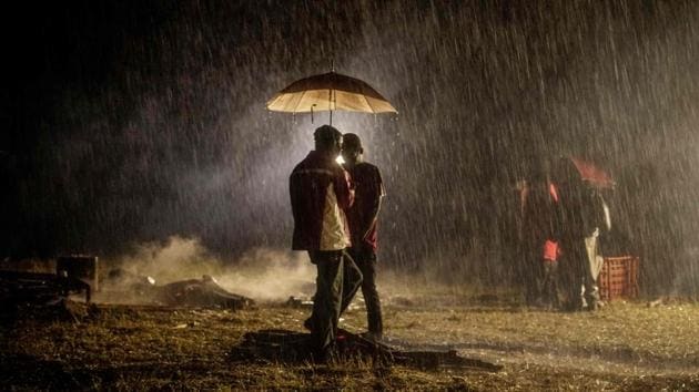 Supporters of the late opposition strongman Morgan Tsvangirai gather under an umbrella as it rains ahead of his burial in the village of Humanikwa, Buhera on February 20. Thousands of Zimbabweans gathered to bid a final farewell to opposition veteran Morgan Tsvangirai, who was one of Africa's most globally admired politicians. (Zinyange Auntony / AFP) Supporters of the late opposition strongman Morgan Tsvangirai gather under an umbrella as it rains ahead of his burial in the village of Humanikwa, Buhera on February 20. Thousands of Zimbabweans gathered to bid a final farewell to opposition veteran Morgan Tsvangirai, who was one of Africa's most globally admired politicians. (Zinyange Auntony / AFP)