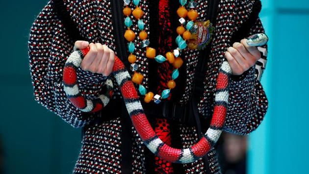 Alessandro Michele, director of Gucci introduced a wild mix of cultures and symbols, from a pagoda hat to a balaclava, a classic burgundy velvet dress to a gold lurex jacket, fine lace to the logo of the New York Yankees. (Tony Gentile / REUTERS)