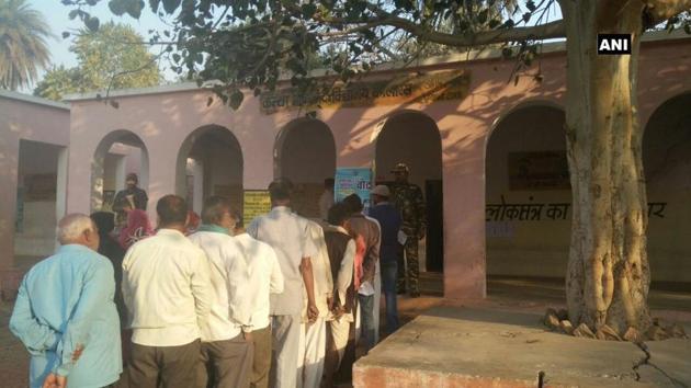 People stand outside a polling booth in Madhya Pradeh’s Kolaras. (ANI Photo) People stand outside a polling booth in Madhya Pradeh’s Kolaras. (ANI Photo)