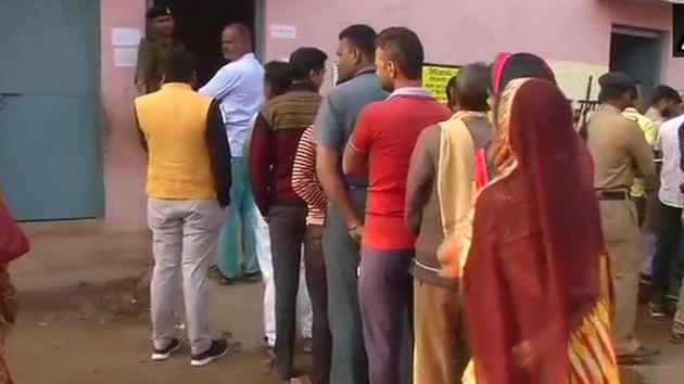 People stand in queue to cast their vote at a polling booth in Kolaras. (Twitter/ANI Photo) People stand in queue to cast their vote at a polling booth in Kolaras. (Twitter/ANI Photo)