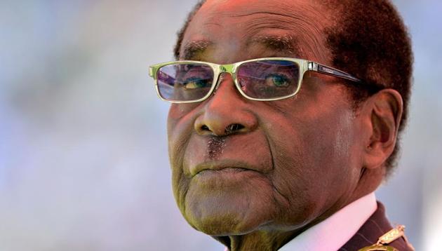 In this file photo taken on August 22, 2013, then Zimbabwean President Robert Mugabe looks on during his inauguration and swearing-in ceremony at the 60,000-seater sports stadium in Harare. Zimbabweans marked Robert Mugabe's 94th birthday on February 21, 2018 with an official day-off, but without the extravagant cakes and fawning tributes that defined this date for much of his 37-year rule. (AFP) In this file photo taken on August 22, 2013, then Zimbabwean President Robert Mugabe looks on during his inauguration and swearing-in ceremony at the 60,000-seater sports stadium in Harare. Zimbabweans marked Robert Mugabe's 94th birthday on February 21, 2018 with an official day-off, but without the extravagant cakes and fawning tributes that defined this date for much of his 37-year rule. (AFP)