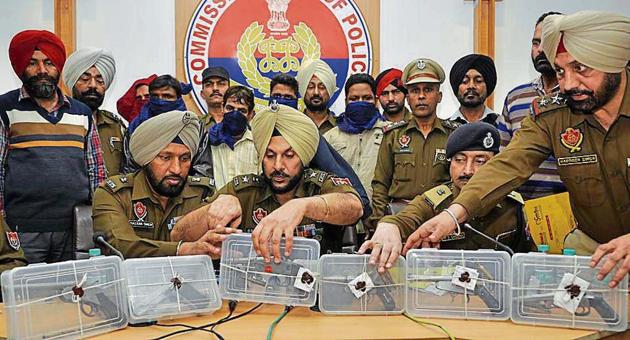 The accused and seized weapons in police custody in Jalandhar on Friday. (HT Photo) The accused and seized weapons in police custody in Jalandhar on Friday. (HT Photo)