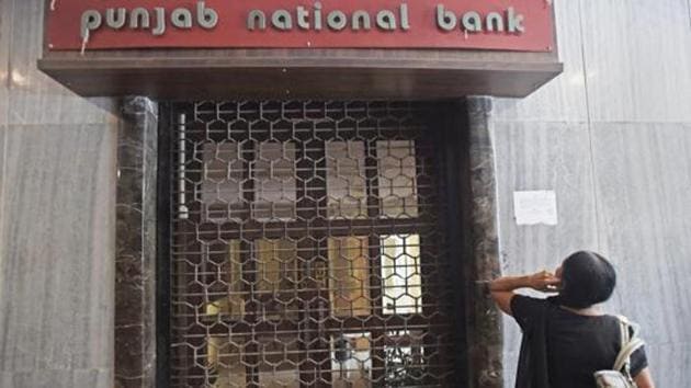 A woman looks on as CBI team seals Punjab National Bank’s South Mumbai branch at Brady House in Mumbai. (PTI File Photo) A woman looks on as CBI team seals Punjab National Bank’s South Mumbai branch at Brady House in Mumbai. (PTI File Photo)