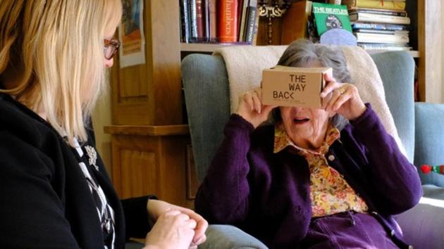 Daphne Padfield, 93, tries out a specialist virtual reality headset at the Langham Court Dementia Home in Hindhead, Britain.(REUTERS)