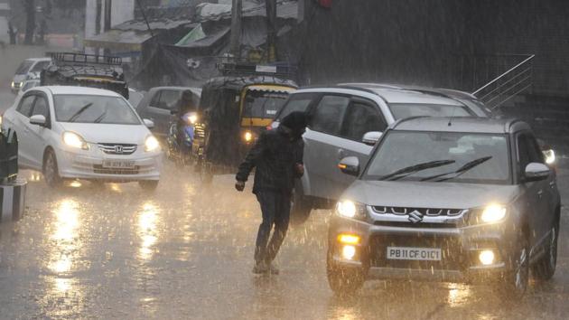 A man runs for shelter in Patiala during downpour on February 12, 2018. (Bharat Bhushan/HT Photo) A man runs for shelter in Patiala during downpour on February 12, 2018. (Bharat Bhushan/HT Photo)