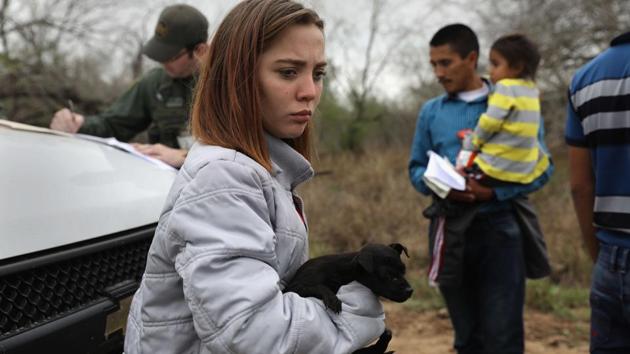 Central American immigrants turn themselves in to Border Patrol agents near McAllen, Texas. The girl, 14, from Honduras said that she had picked up the puppy in Reynosa, Mexico during her journey. Thousands of Central American families continue to enter the US, most seeking political asylum from violence in their home countries. The Rio Grande Valley has the highest number of undocumented immigrant crossings and narcotics smuggling of the entire US-Mexico border.(AFP) Central American immigrants turn themselves in to Border Patrol agents near McAllen, Texas. The girl, 14, from Honduras said that she had picked up the puppy in Reynosa, Mexico during her journey. Thousands of Central American families continue to enter the US, most seeking political asylum from violence in their home countries. The Rio Grande Valley has the highest number of undocumented immigrant crossings and narcotics smuggling of the entire US-Mexico border.(AFP)