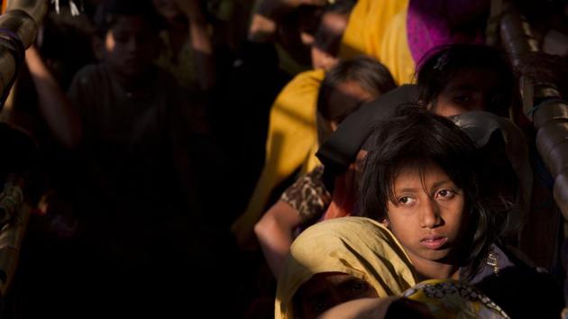 Rohingya Muslim women refugees wait in a queue to receive relief material at the Balukhali refugee camp near Cox's Bazar, Bangladesh, Saturday, Jan. 27, 2018. T(AP File Photo) Rohingya Muslim women refugees wait in a queue to receive relief material at the Balukhali refugee camp near Cox's Bazar, Bangladesh, Saturday, Jan. 27, 2018. T(AP File Photo)