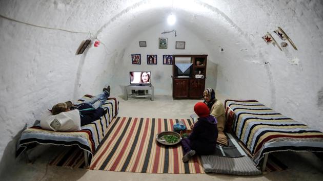 Samar, 18, and Latifa Ben Yahia, 38, (C) shell peas as their brother watches television at their five-room home in the village of Tijma. “My father died, my mother died, the girls got married and I was left alone. They all went to lead their own lives,” said Latifa. “If I leave then the house will be gone.” (Zohra Bensemra / REUTERS) Samar, 18, and Latifa Ben Yahia, 38, (C) shell peas as their brother watches television at their five-room home in the village of Tijma. “My father died, my mother died, the girls got married and I was left alone. They all went to lead their own lives,” said Latifa. “If I leave then the house will be gone.” (Zohra Bensemra / REUTERS)