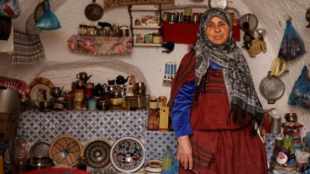 Mounjia, 60, poses for photograph in the kitchen of her house. “I don’t want to leave my troglodyte house for a modern one, we could buy everything but not peace of mind,” Mounjia said. Like her, the few remaining families say they are attached to their houses and the land or see no way of moving. (Zohra Bensemra / REUTERS) Mounjia, 60, poses for photograph in the kitchen of her house. “I don’t want to leave my troglodyte house for a modern one, we could buy everything but not peace of mind,” Mounjia said. Like her, the few remaining families say they are attached to their houses and the land or see no way of moving. (Zohra Bensemra / REUTERS)