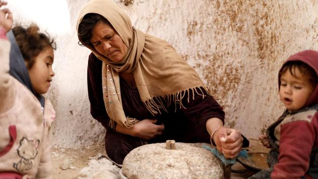 Saliha Mohamedi grinds wheat at her house where she lives with her husband and four children and lets tourists visit in return for tips. “Before the revolution there was tourism. Since then there’s not been much, just some Tunisians who come on days off or holidays,” she said. (Zohra Bensemra / REUTERS) Saliha Mohamedi grinds wheat at her house where she lives with her husband and four children and lets tourists visit in return for tips. “Before the revolution there was tourism. Since then there’s not been much, just some Tunisians who come on days off or holidays,” she said. (Zohra Bensemra / REUTERS)