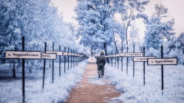 The monumental trail in Chernobyl with the evacuated village names by the side.(Vladimir Migutin)