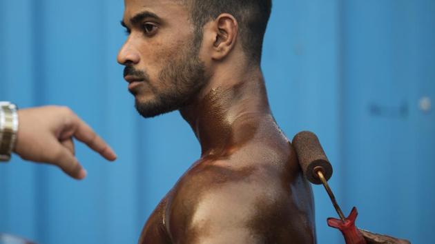 A participant spends a quiet moment before the competition getting ready before the contest begins. (Satish Bate/HT)