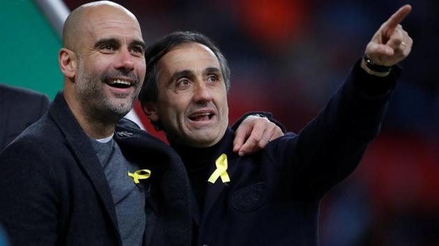 Manchester City manager Pep Guardiola (L) wearing the yellow ribbon during the League Cup final vs Arsenal at the Wembley Stadium in London. (Reuters) Manchester City manager Pep Guardiola (L) wearing the yellow ribbon during the League Cup final vs Arsenal at the Wembley Stadium in London. (Reuters)