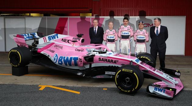 Nikita Mazepin, Esteban Ocon and Sergio Perez of Force India during their presentation ceremony at the Circuit de Catalunya, Montmelo, Spain.(REUTERS)