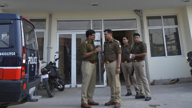 Policemen stand outside Narmada tower of Mahagun Puram high-rise where a 35-year-old woman slashed her wrists in an attempt to kill herself and pushed her daughter to hang herself, on February 25. (Sakib Ali /HT Photo) Policemen stand outside Narmada tower of Mahagun Puram high-rise where a 35-year-old woman slashed her wrists in an attempt to kill herself and pushed her daughter to hang herself, on February 25. (Sakib Ali /HT Photo)