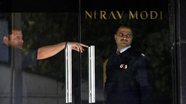 A security guard stands guard inside a Nirav Modi showroom during a raid by the Enforcement Directorate.(REUTERS File Photo) A security guard stands guard inside a Nirav Modi showroom during a raid by the Enforcement Directorate.(REUTERS File Photo)