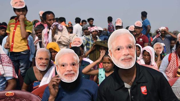 BJP supporters wear masks of Prime Minister Narendra Modi during an election rally at Phulbari in Meghalaya’s West Garo Hills recently.(AFP photo) BJP supporters wear masks of Prime Minister Narendra Modi during an election rally at Phulbari in Meghalaya’s West Garo Hills recently.(AFP photo)