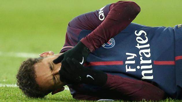 Paris Saint-Germain’s Neymar lies on the pitch after sustaining an injury in a Ligue 1 match vs Olympique de Marseille at Parc des Princes in Paris on Sunday. (Reuters) Paris Saint-Germain’s Neymar lies on the pitch after sustaining an injury in a Ligue 1 match vs Olympique de Marseille at Parc des Princes in Paris on Sunday. (Reuters)