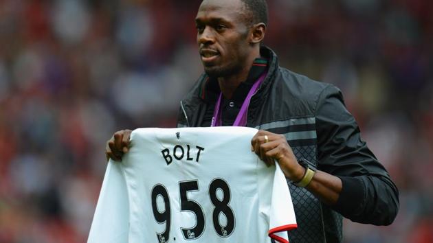 (File photo) Jamaican Athlete Usain Bolt poses with a United shirt prior to the Barclays Premier League match between Manchester United and Fulham at Old Trafford on August 25, 2012.(Getty Images) (File photo) Jamaican Athlete Usain Bolt poses with a United shirt prior to the Barclays Premier League match between Manchester United and Fulham at Old Trafford on August 25, 2012.(Getty Images)