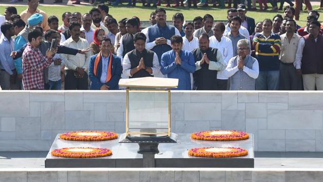 Delhi BJP President Shri Manoj Tiwari with party supporters at a prayer meeting during ‘Samvidhan ki Shapth’ protest against Kejriwal government at Rajghat, in New Delhi on Monday. (Sanchit Khanna / HT Photo) Delhi BJP President Shri Manoj Tiwari with party supporters at a prayer meeting during ‘Samvidhan ki Shapth’ protest against Kejriwal government at Rajghat, in New Delhi on Monday. (Sanchit Khanna / HT Photo)
