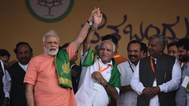 PM Narendra Modi with Karnataka leader BS Yeddyurappa at an event in Davangere, on Tuesday. (Arijit Sen/HT Photo) PM Narendra Modi with Karnataka leader BS Yeddyurappa at an event in Davangere, on Tuesday. (Arijit Sen/HT Photo)