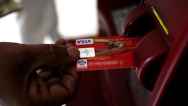 A customer uses his card to withdraw money from an ATM.(Reuters file/Representative image)