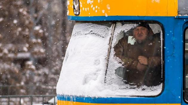 A man looks out from a tram during snowfall in Sofia, Bulgaria. A string of major football matches, including Italian Cup bouts on Wednesday between Juventus/Atalanta and AC Milan/Lazio, could be postponed if the cold weather continues, officials have warned. (Nikolay Doychinov / AFP) A man looks out from a tram during snowfall in Sofia, Bulgaria. A string of major football matches, including Italian Cup bouts on Wednesday between Juventus/Atalanta and AC Milan/Lazio, could be postponed if the cold weather continues, officials have warned. (Nikolay Doychinov / AFP)