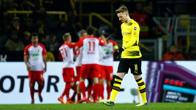 Borussia Dortmund’s Marco Reus looks dejected after Augsburg's Kevin Danso scores their first goal on Monday. (REUTERS) Borussia Dortmund’s Marco Reus looks dejected after Augsburg's Kevin Danso scores their first goal on Monday. (REUTERS)