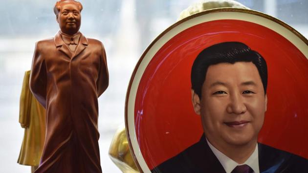A decorative plate featuring an image of Chinese President Xi Jinping is seen beside a statue of late Communist leader Mao Zedong at a souvenir store next to Tiananmen Square in Beijing on February 27, 2018. China's propaganda machine has kicked into overdrive to defend the Communist Party's move to scrap term limits for President Xi Jinping as critics on social media again defied censorship attempts. (AFP) A decorative plate featuring an image of Chinese President Xi Jinping is seen beside a statue of late Communist leader Mao Zedong at a souvenir store next to Tiananmen Square in Beijing on February 27, 2018. China's propaganda machine has kicked into overdrive to defend the Communist Party's move to scrap term limits for President Xi Jinping as critics on social media again defied censorship attempts. (AFP)
