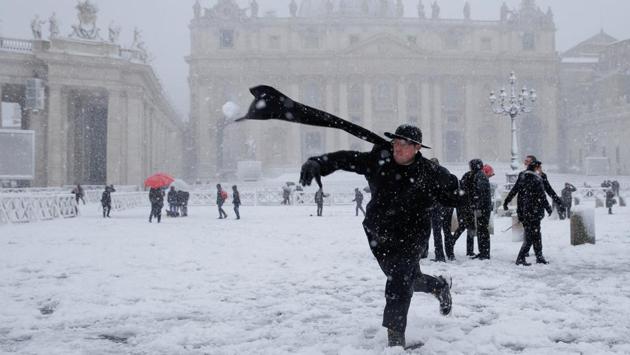 A young priest throws a snow ball during in Saint Peter's Square at the Vatican. Meteorologists have documented temperatures above freezing in some parts of the Arctic, causing astonishment among many scientists. (Max Rossi / REUTERS) A young priest throws a snow ball during in Saint Peter's Square at the Vatican. Meteorologists have documented temperatures above freezing in some parts of the Arctic, causing astonishment among many scientists. (Max Rossi / REUTERS)