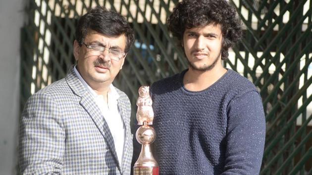 Utsav Arora (right) with his father Yogesh Arora showing his bronze award in Amritsar on Monday. (HT Photo) Utsav Arora (right) with his father Yogesh Arora showing his bronze award in Amritsar on Monday. (HT Photo)