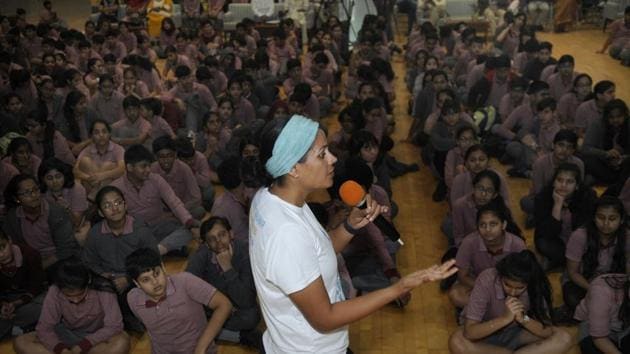 Srishti Bakshi interacts with Genesis Global School students in Noida on Tuesday.(Sunil Ghosh /ht photo)