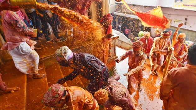 While on the first day men from Nandgaon make the attempt into Barsana, with the women there fending them off, the second day is a reversal of roles and Barsana’s menfolk land into Nadgaon with colour only to be greeted with sticks themselves. (Ajay Aggarwal / HT Photo) 