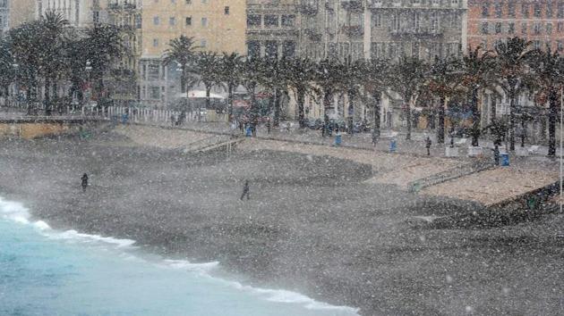 People walk through the Promenade des Anglais in Nice, France. Even the Mediterranean has seen flurries, with snow falling in Nice and drifts forcing authorities to close numerous motorways along Croatia’s Adriatic coast. (Valery Hacie / AFP) People walk through the Promenade des Anglais in Nice, France. Even the Mediterranean has seen flurries, with snow falling in Nice and drifts forcing authorities to close numerous motorways along Croatia’s Adriatic coast. (Valery Hacie / AFP)