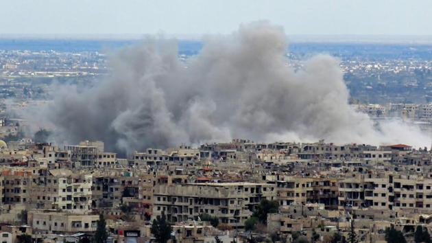 A general view taken from a government-held area in Damascus shows smoke rising from the rebel-held enclave of Eastern Ghouta on the outskirts of the Syrian capital. (AFP Photo) A general view taken from a government-held area in Damascus shows smoke rising from the rebel-held enclave of Eastern Ghouta on the outskirts of the Syrian capital. (AFP Photo)