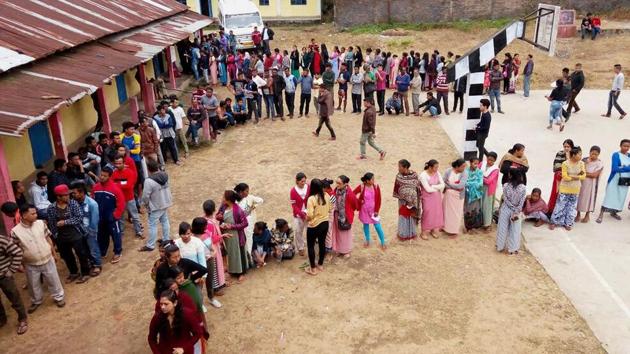 People stand in queues to cast their votes for state Assembly elections, at a polling station in Ri Bhoi district of Meghalaya on Tuesday. (PTI Photo) People stand in queues to cast their votes for state Assembly elections, at a polling station in Ri Bhoi district of Meghalaya on Tuesday. (PTI Photo)